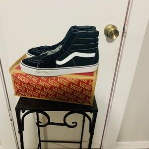 Black and white high top Vans. Size 10.5 ladies size 9 in men’s. Gently used.